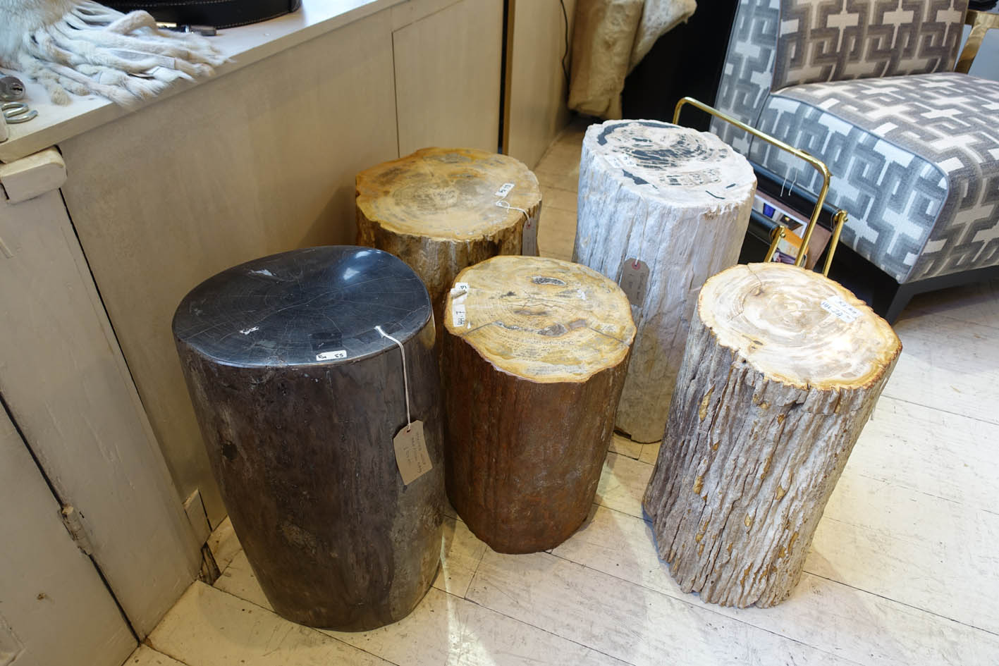 Petrified wood is a natural product. It is the result of a tree having completely transitioned to stone by the process of mineralization though centuries. These can be used as side table or stools. these are seriously heavy and weight in excess of 60 Kilos each!