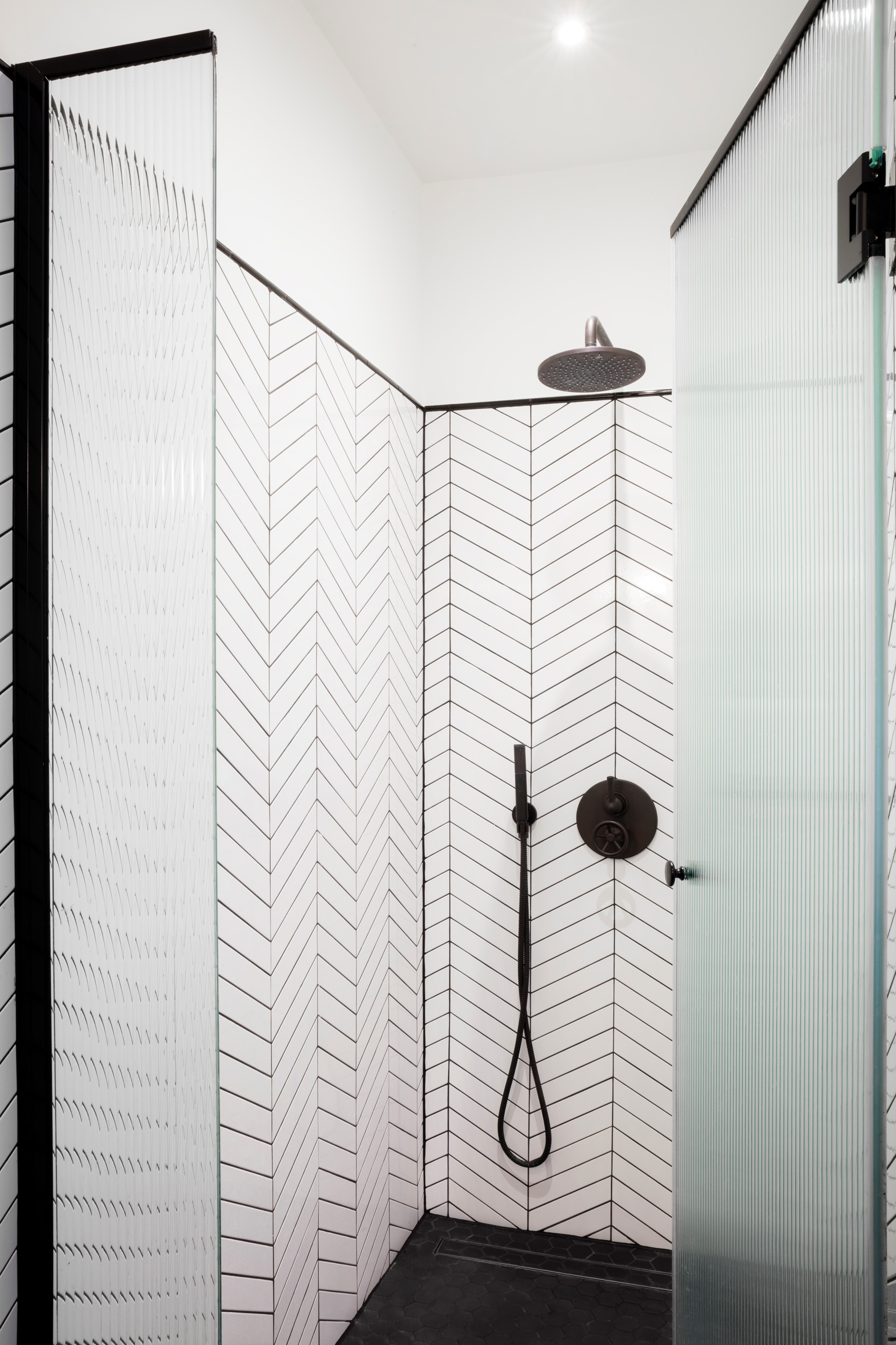 A great way to modernize the bathroom - match your grouting with a shower in 'Gun Metal'