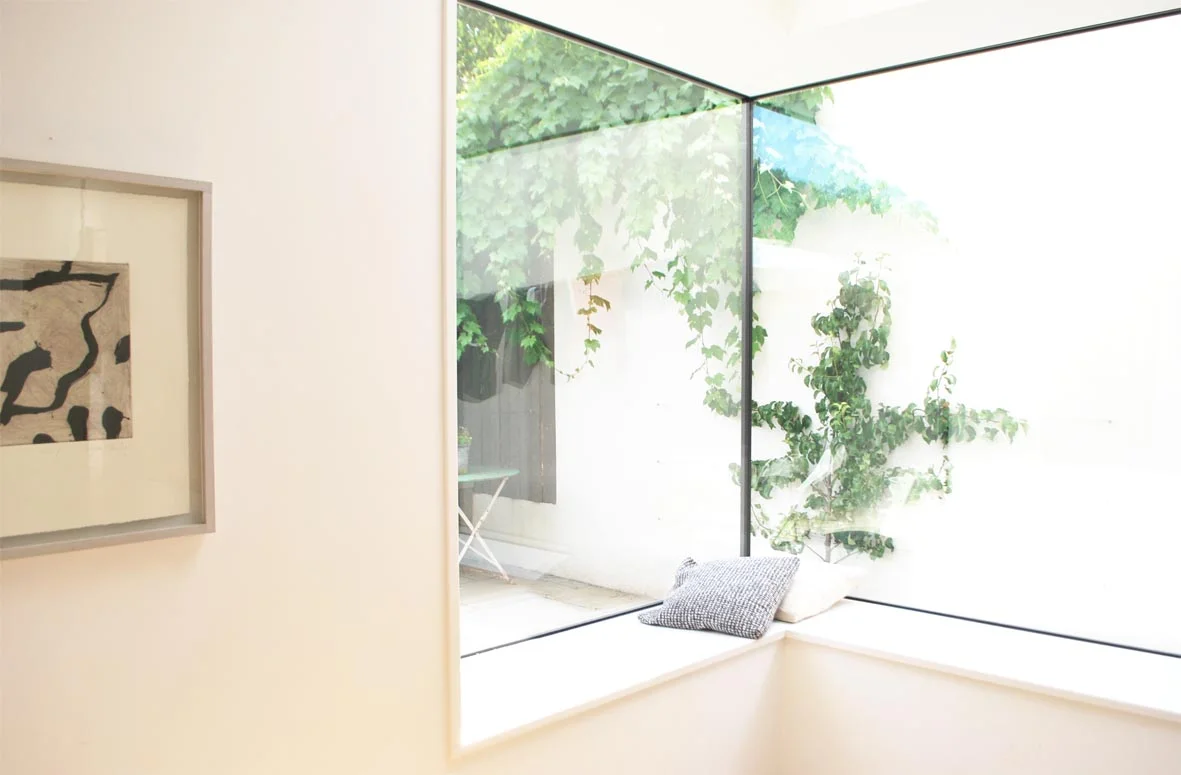 The corner window seat is such a great feature in this space.