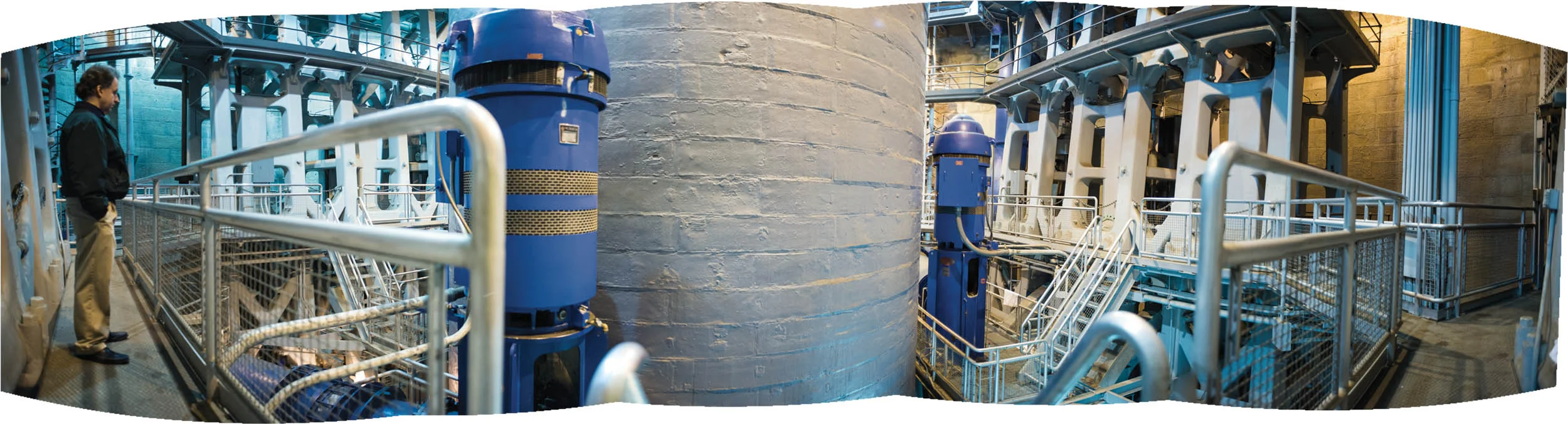Inside the River Station Pump House Jeff Swertfeger stands in front of one of the upgraded pumps (dark blue). Retro-fitted with state-of-the-art equipment, the pump house still houses all four of the original steam-powered engines. Details of their construction and service can be found at CincinnatiTripleSteam.org–tours are held monthly. An engineering marvel when it was constructed in early 1900, the pump house holds four of the world’s largest steam-powered vertical pumps. Each engine with a 30,000,000 gallon capacity ran continuously for 57 years until decommissioned in the early 1960s.
