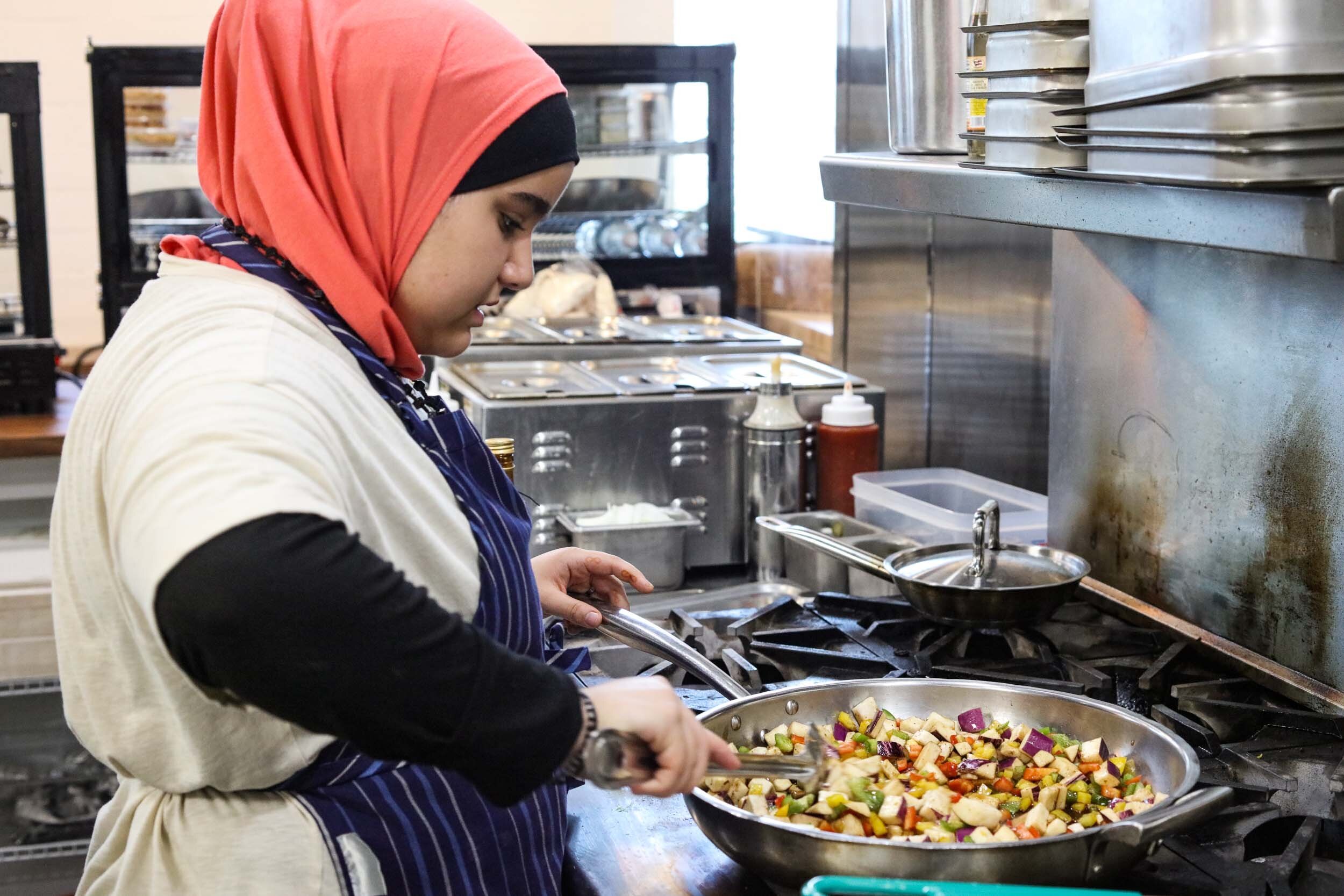  Syrian cook, Ibtisam Masto, shares her culinary heritage with Cincinnati. Find her and her family at the Oakley Kitchen Food Hall or Findlay Market on the weekends. Photo by Julie Kramer 