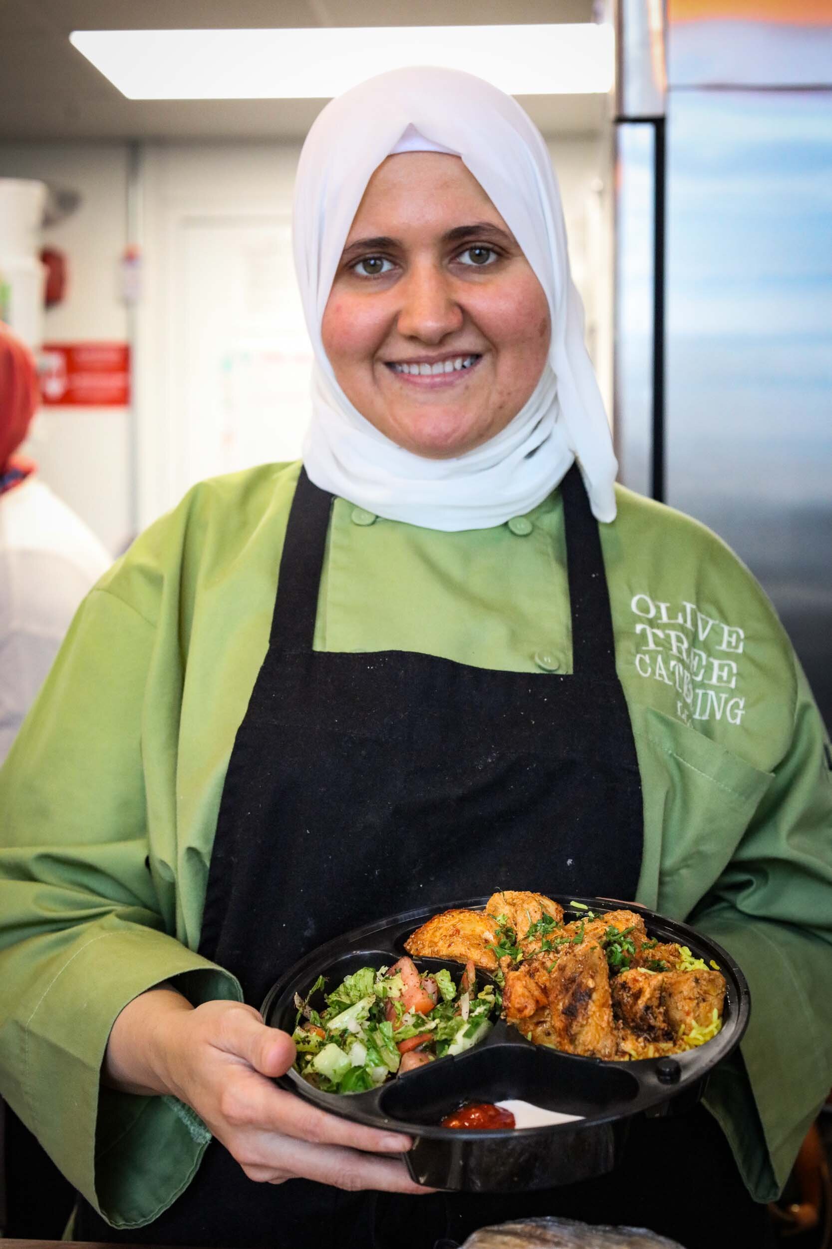  Syrian cook, Ibtisam Masto (pictured), shares her culinary heritage with Cincinnati. Find her and her family at the Oakley Kitchen Food Hall or Findlay Market on the weekends. Photo by Julie Kramer 