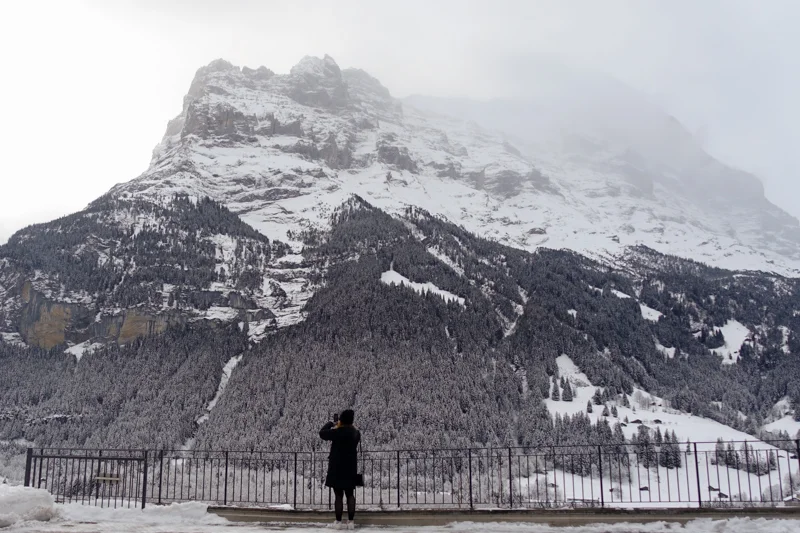 Picture of Maddie taking a picture of mountains