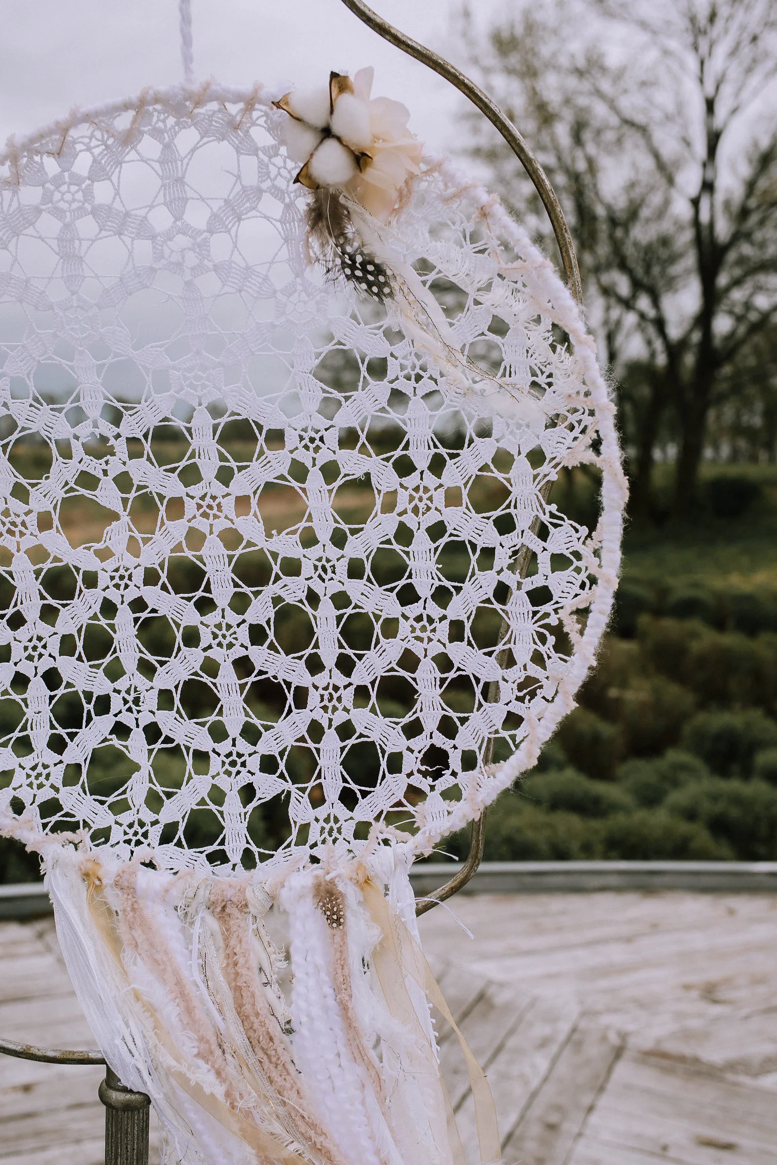 Ceremony site at Chatham University with bohemian dream catchers from Vintage Alley Rentals.