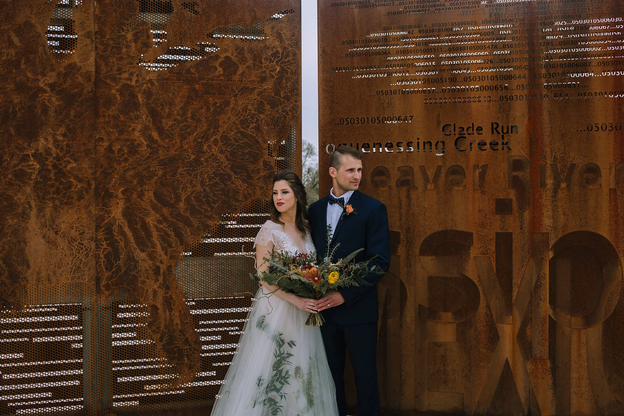 Bohemian wedding at Chatham University, Eden Hall Farm designed by Exhale Events. Bride's look from Blanc de Blanc Bridal, Melissa Gown by Divine Atelier. Groom's suit from H&M. Bridal bouquet and boutineer from Community Flower Shop.