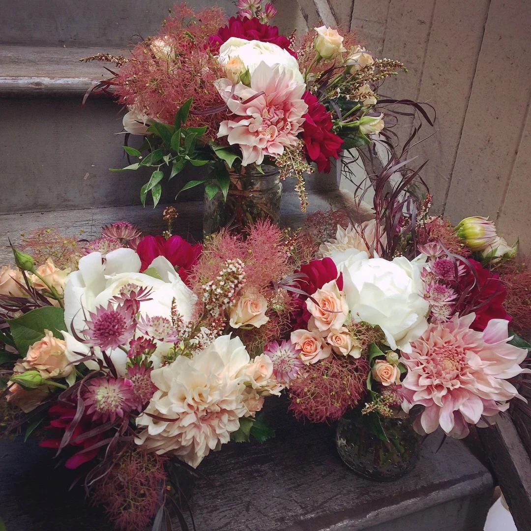  Centerpieces made using peonies, dahlias, smoke bush, spray roses, calcynia, and astrantia. Made for a client at The Bud Stop.&nbsp; 