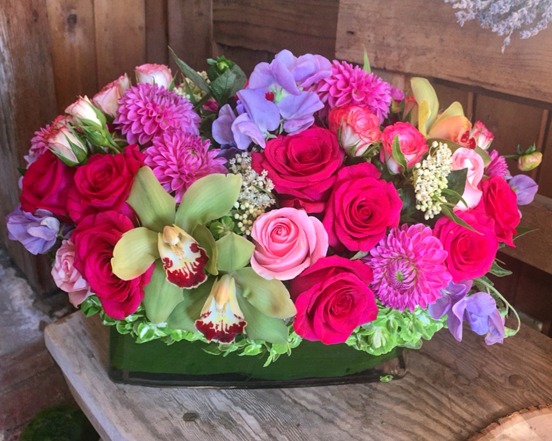 Long and low bouquet for a birthday. Flowers provided by Palisades Flowers.