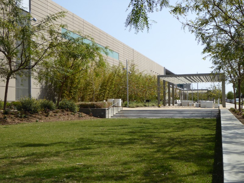 Sunken lawn area + shade structure + wall of Metro maintenance building