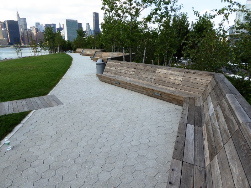 Seating along upper slope with views across River to Manhattan