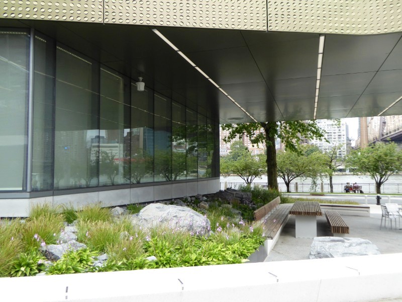 Sitting area below overhang of Bloomberg Center building