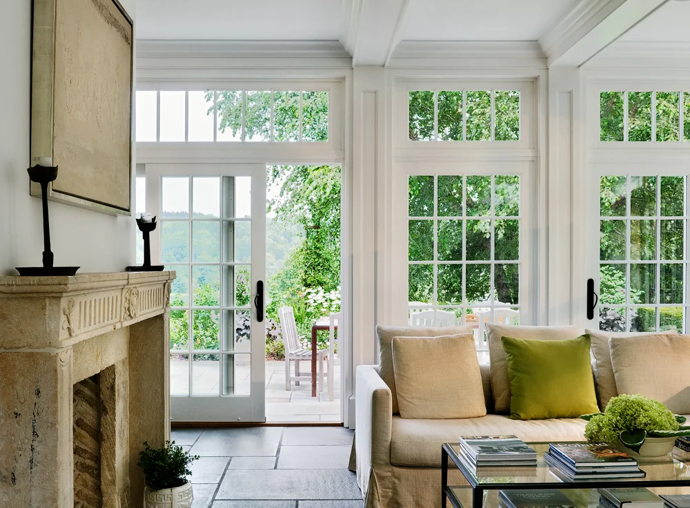 French Doors with Transoms - When trying to make a small room feel substantial, we find that light and architectural details go a long way.