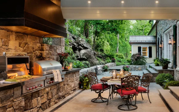 The outdoor kitchen is covered and not too far from the main kitchen.