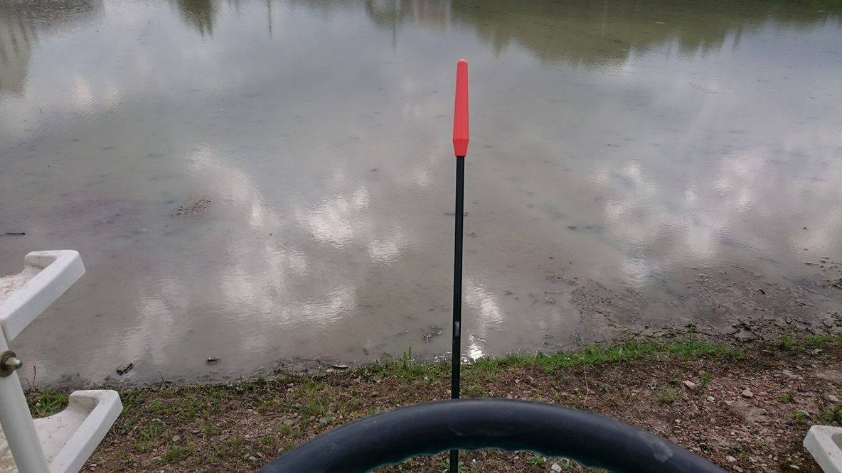 The red pole is to follow a guideline that the tractor makes in the mud. The water level was too high, so it was hard to keep a straight line because I couldn't see the guideline. So my planting was a little crooked. But we finished the job and that's all that matters. 