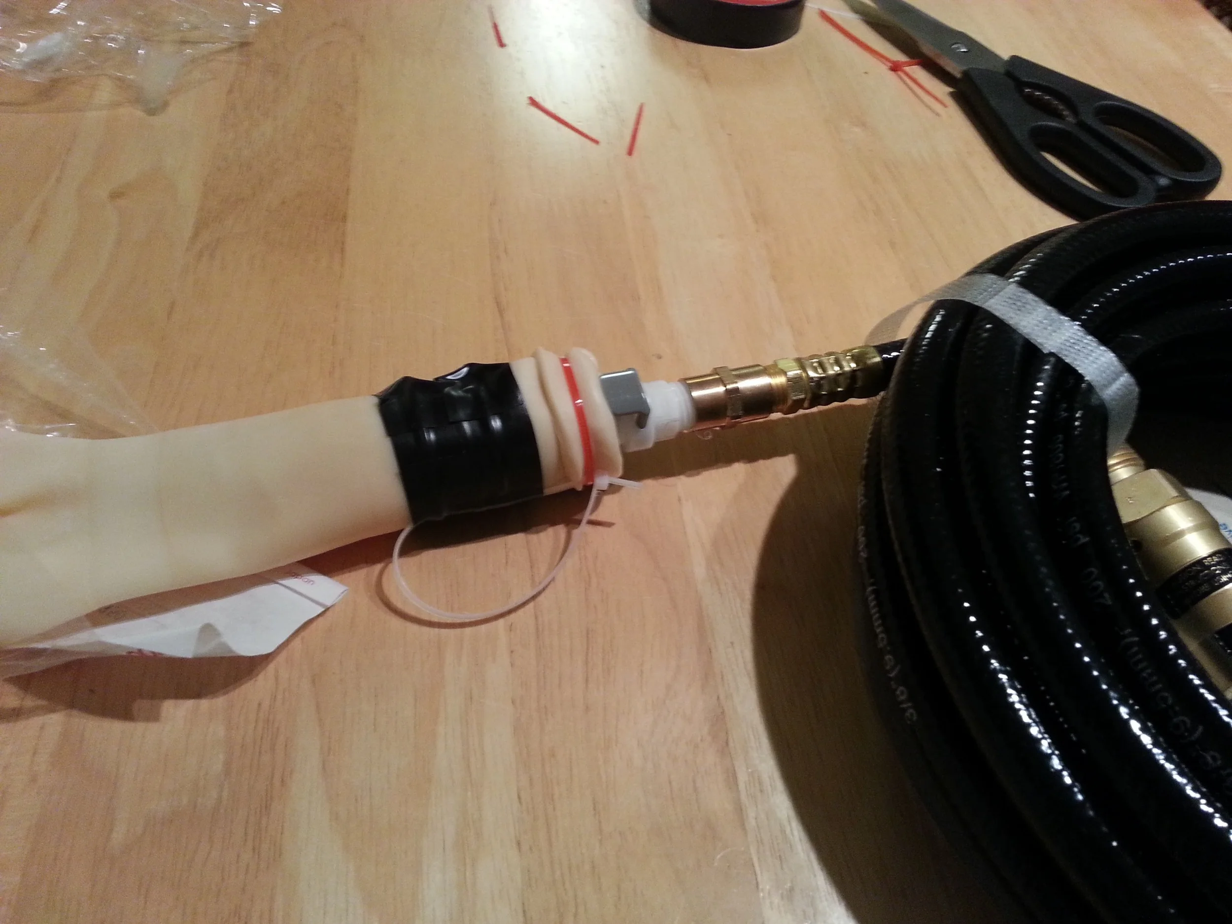 The adapter is now ready to use! Plug in the quick-disconnect fill hose to the balloon to test the fit, and you are ready to fill on launch day. The clear zip-tie loop can be used with the fish-scale to measure the nozzle lift during filling. Simply detach the hose, measure the lift, and then re-attach when ready to continue filling.