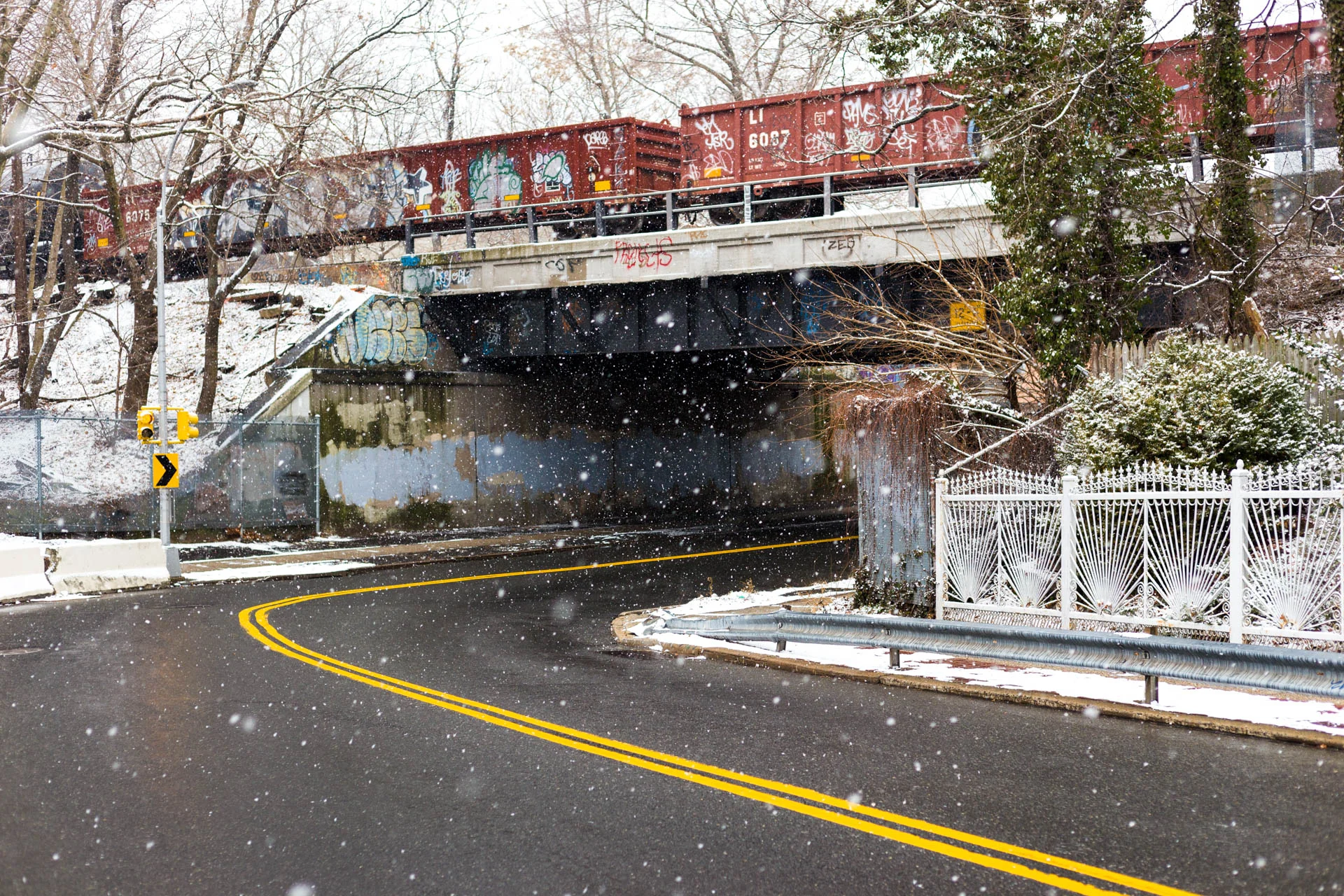 There's a nice little park just a few blocks from my house, just to the left of the frame here. In order to get there, I walk under this rail bridge and out to this little curve in the road. The curve here is really pleasant and I always enjoy it when I'm driving around this corner, so I wanted to capture that here.
