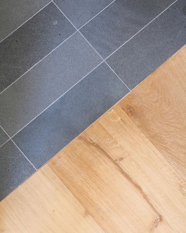When it comes to material selection we love simple &amp; timeless finishes that stand the test of time. Case in point honed basalt tile next to this sunny white oak floor... makes for the perfect transition in our Port Streets project 📸: @ryangarvin
