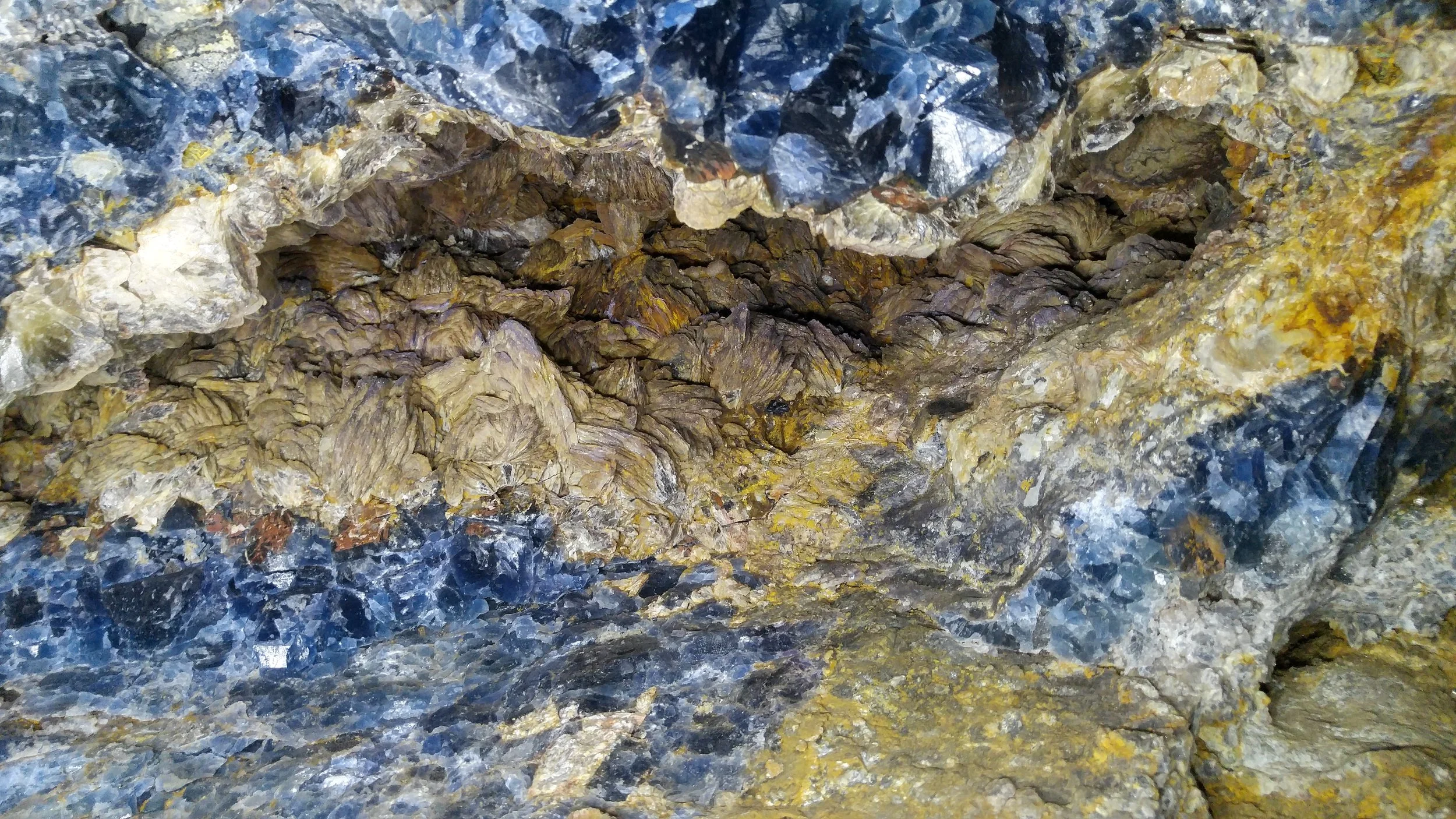 Ceiling of Upper Adit - Fluorite Filled Vug with Large Barite Blades Formed Inside