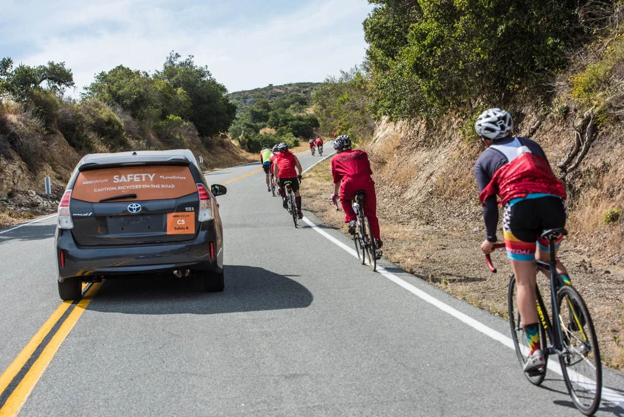 Thousands unite, cycling in the fight against HIV/AIDS. Representing Toyota, I was warmly welcomed into the “Love Bubble.”