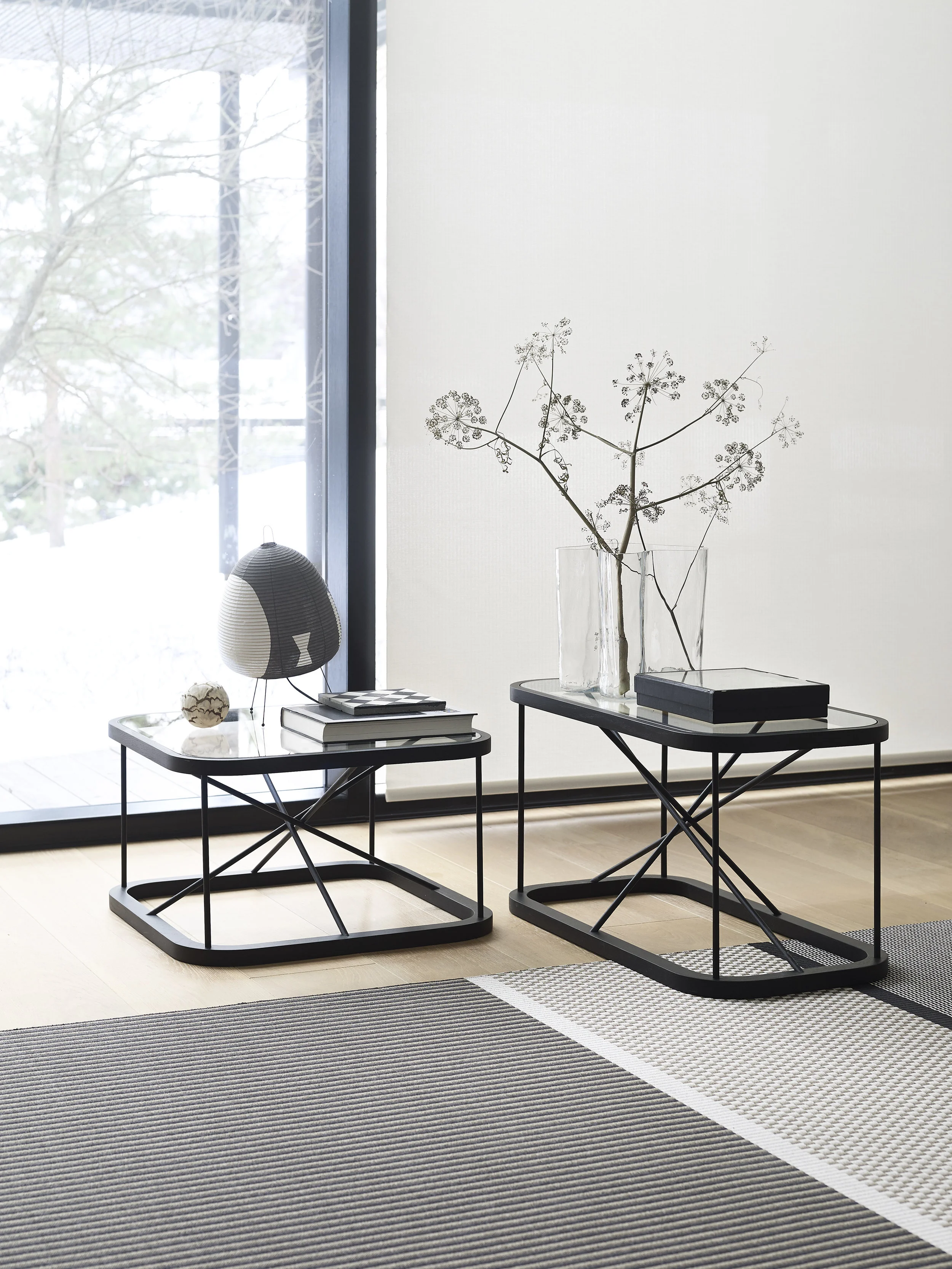 Stained black Twiggy oak tables , size 66,5x66,5x38,5 cm and 44x88x45,5 cm, together with San Francisco paper yarn carpet col. 1433215 nutria-stone.