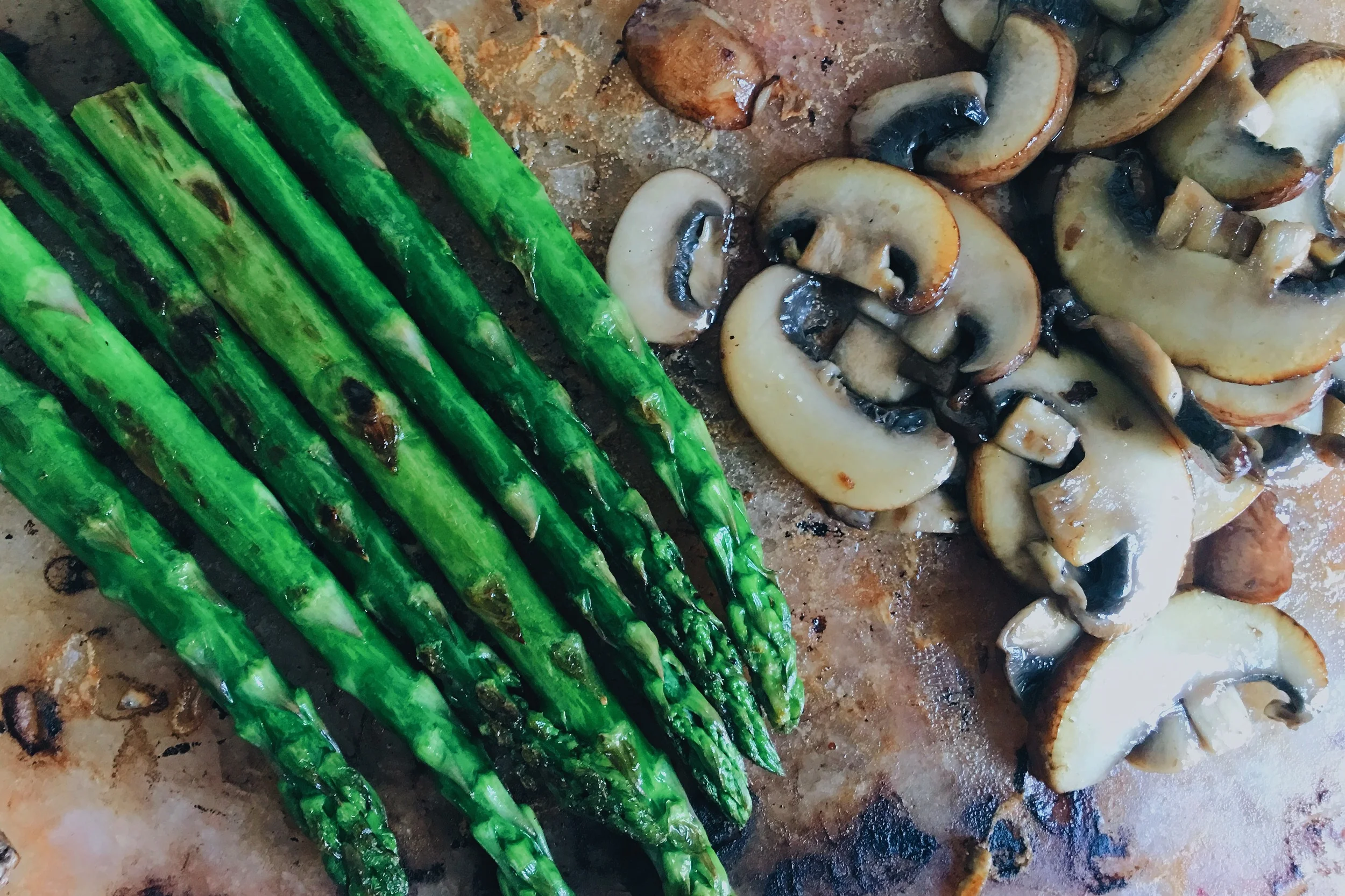 Asparagus and mushroom on Himalyan salt block