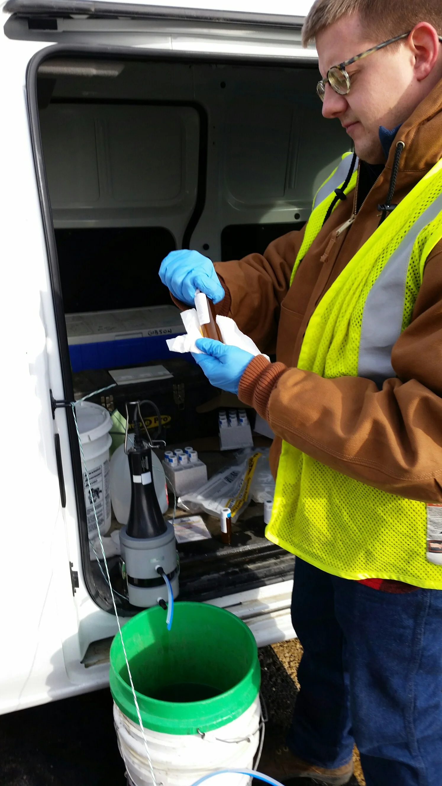 KERAMIDA Staff Scientist collecting groundwater samples for analysis of volatile organic compounds (VOCs).