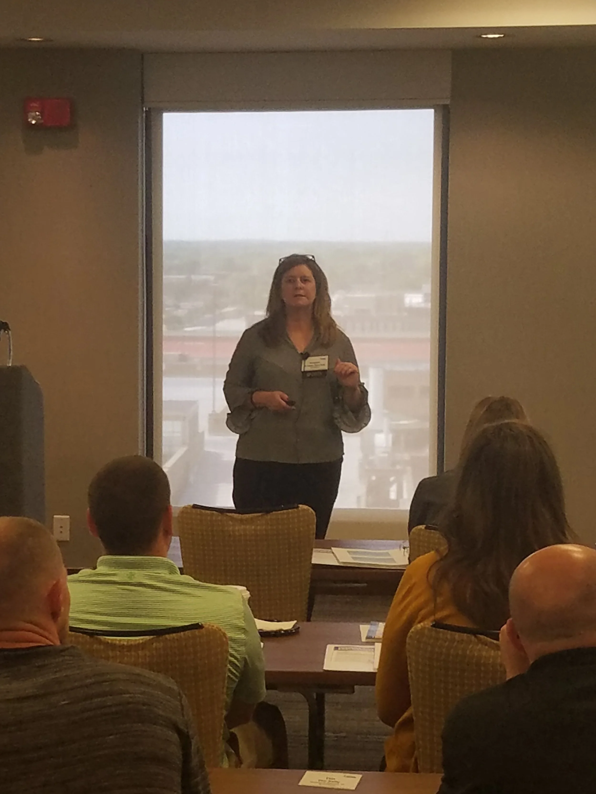 Kristen Belcredi, P.E., C.H.M.M., ISO Auditor, Senior Vice President, Engineering Services, presenting "Water Permitting 101"