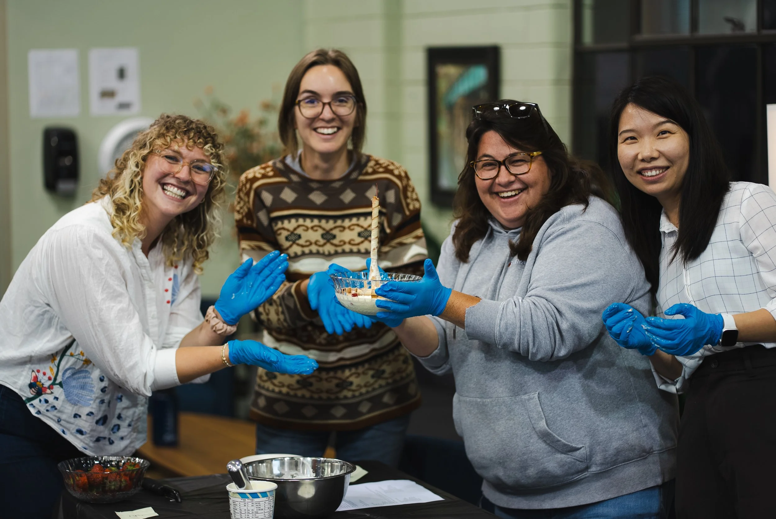  One team's finished tower, standing tall (until the ice cream melts). (Left to right: Genny Willman, PE, AAAE CM, Senior Manager, Compliance Engineering Services; Claudia Cozadd, MS, SCR, Senior Analyst, Sustainability; Chelsea McCammack, LPG, Proje