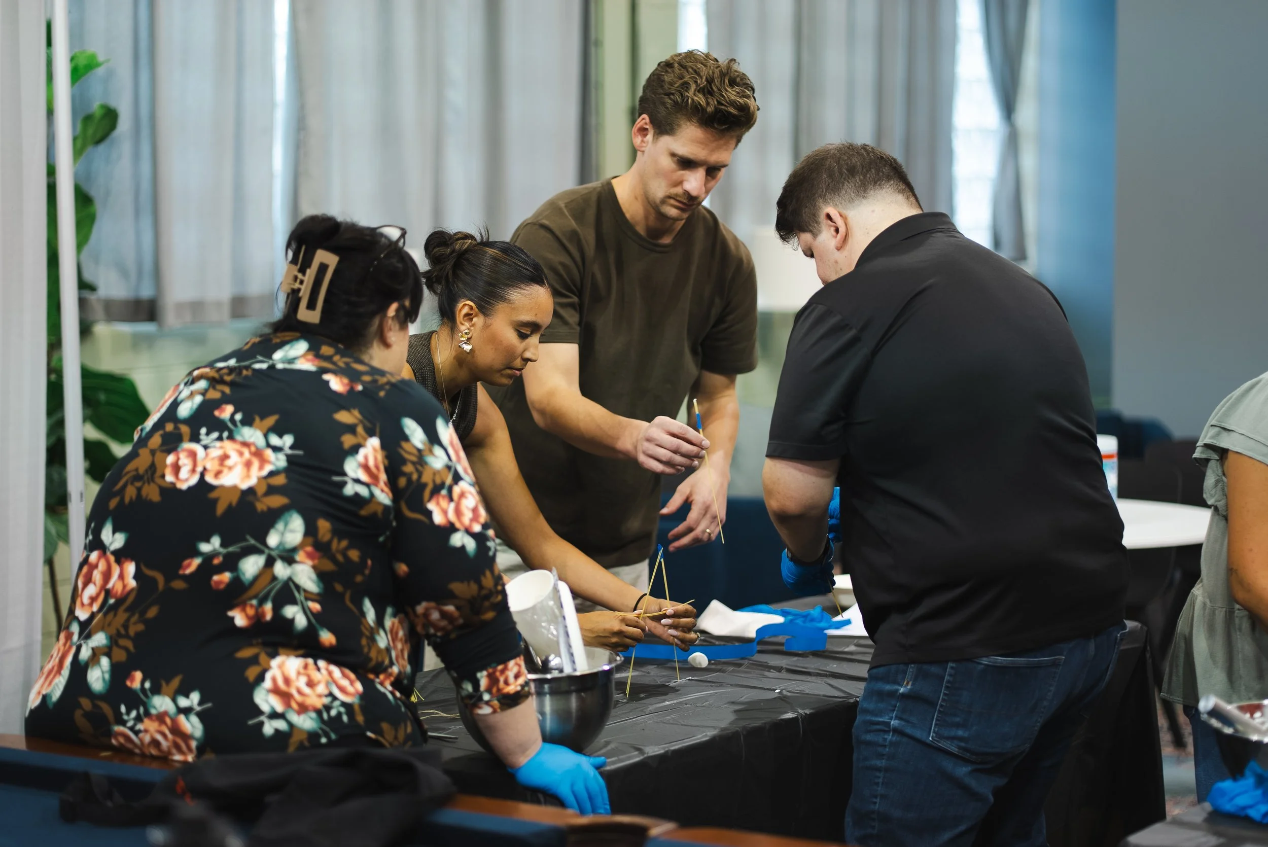  All hands on deck for tower construction. (Left to right: Roxanne Marsh, Admin; Jenae Mona, Staff Engineer; Nick McCreary, MS, LEED AP BD+C, Senior Vice President, Sustainability; and Jay Nickel, Project Manager, Land Services.) 