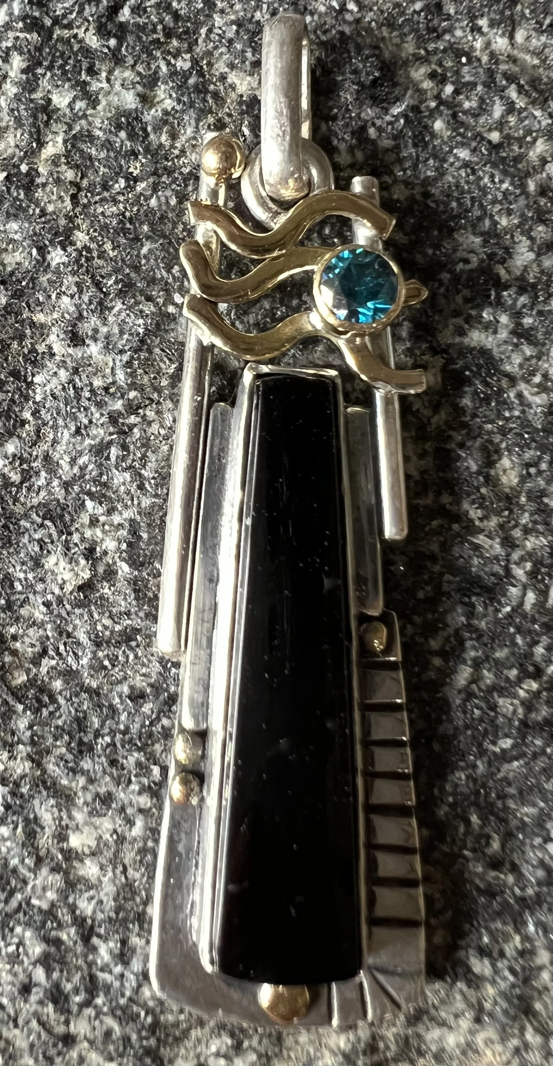 Onyx and blue diamond pendant