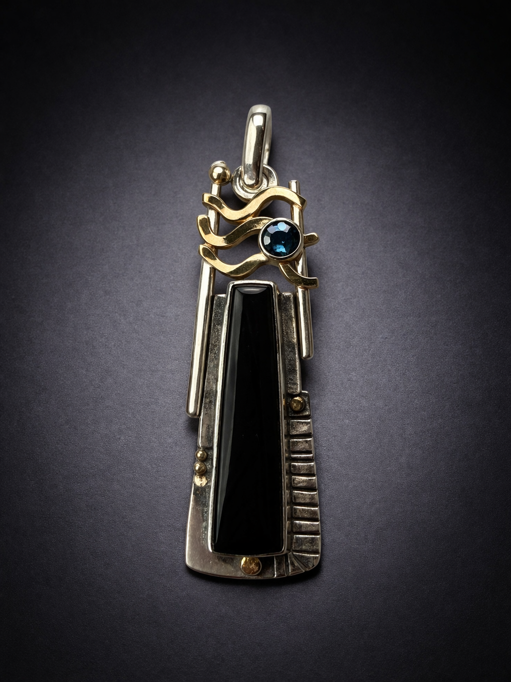 Onyx and blue diamond pendant