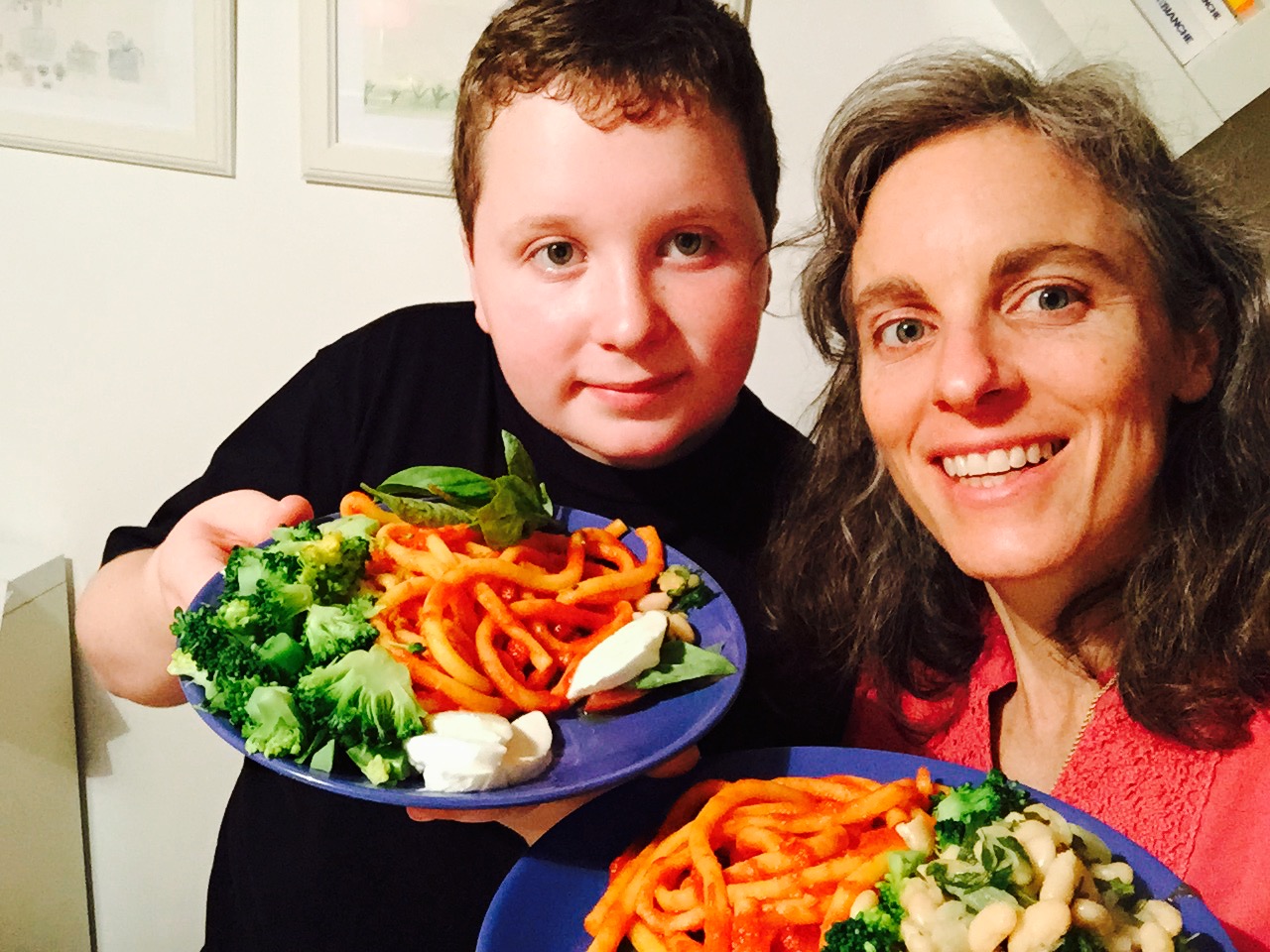 Paula and her son enjoying a home cooked meal they prepared during their trip to Italy.