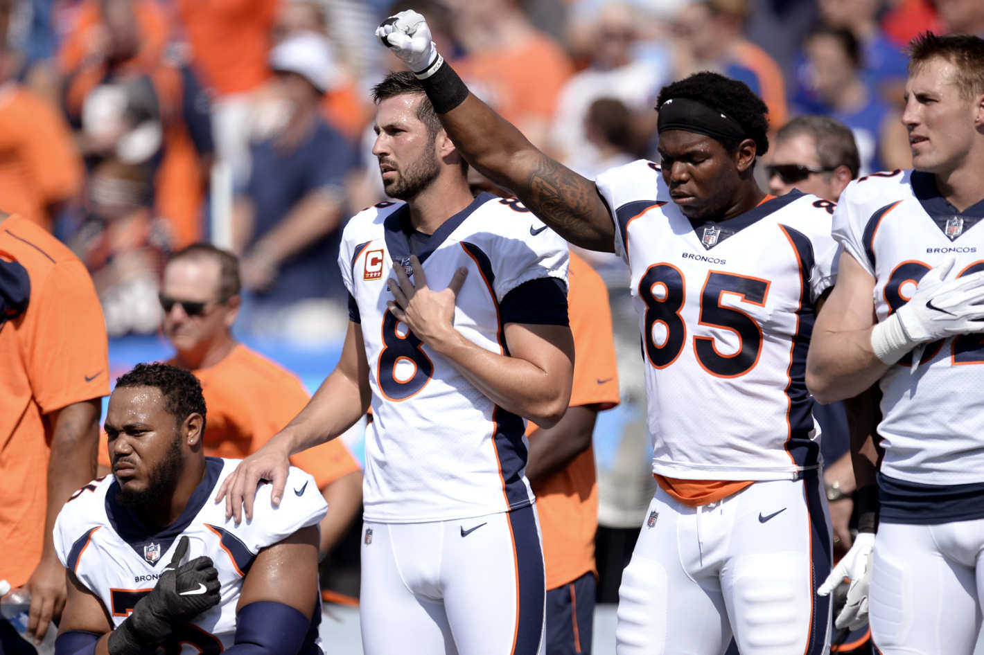 Denver Broncos players demonstrate in solidarity during the national anthem at Sunday's game against the Buffalo Bills. Photo: Adrian Kraus/AP