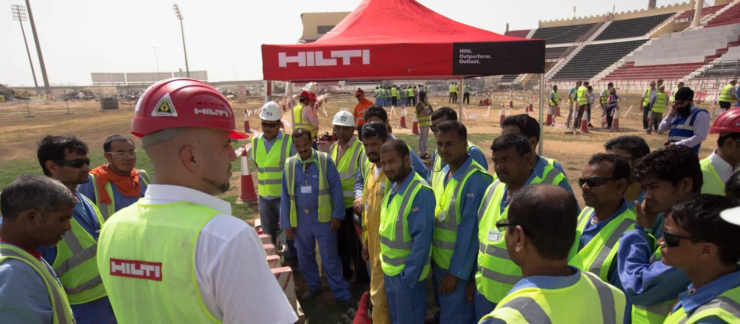 Migrant workers at World Cup construction site in Qatar. Image from FIFA.COM website (copyright LOC)