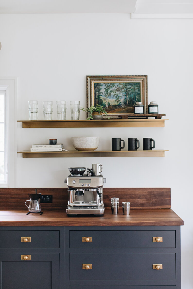 kitchen coffee station with brass and wood shelves