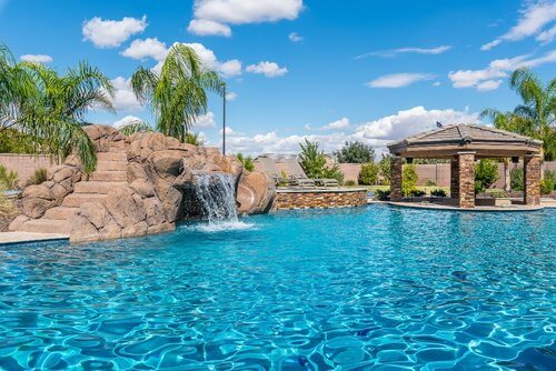 Wide Open Swimming Pool Design with Waterfall Slide Swimup Bar.jpg