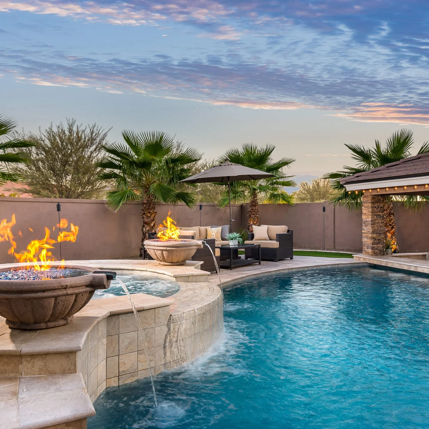 Parenti - Custom Spa, swim-up bar, spillover, and fire features.jpg