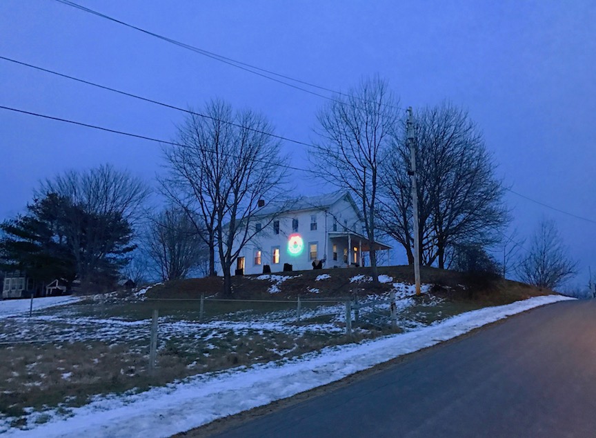 A Big wreath turns this farmhouse on Maple Ave into a living Christmas Card