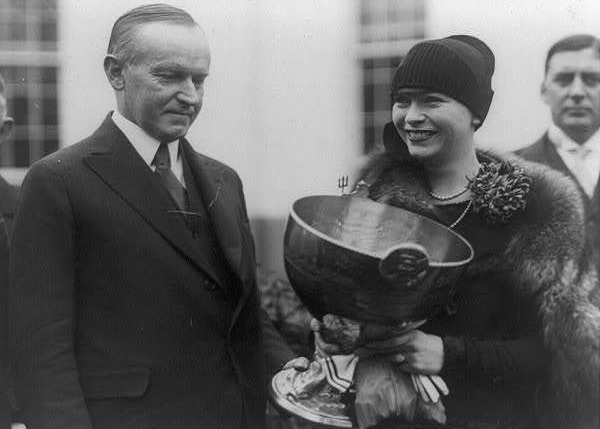Delphine being presented her trophy by President Calvin Coolidge