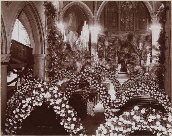 Floral arches and a bank of Palm trees at St Thomas Church