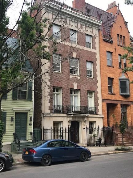 A wood frame home from the 1840's (left) next to the Huyck Residence built circa 1904, and a Dutch Revival home from 1898