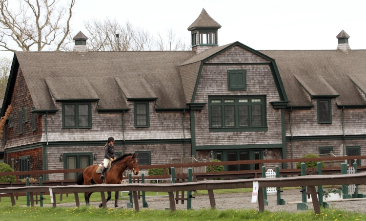 Rider in front of the former stables (now condominiums)