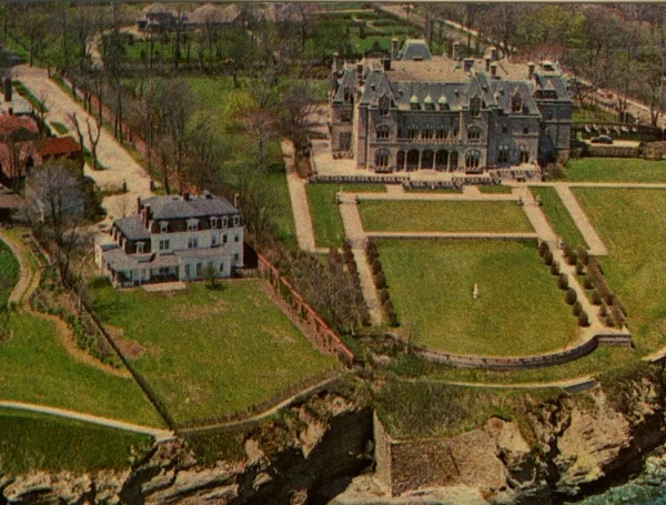 Ochre Court (right) dwarfs its neighboring cottage from an earlier era