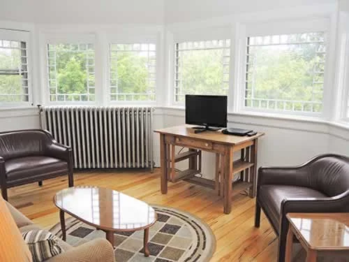Though obscured by trees today, this third floor room originally had views of the lake.
