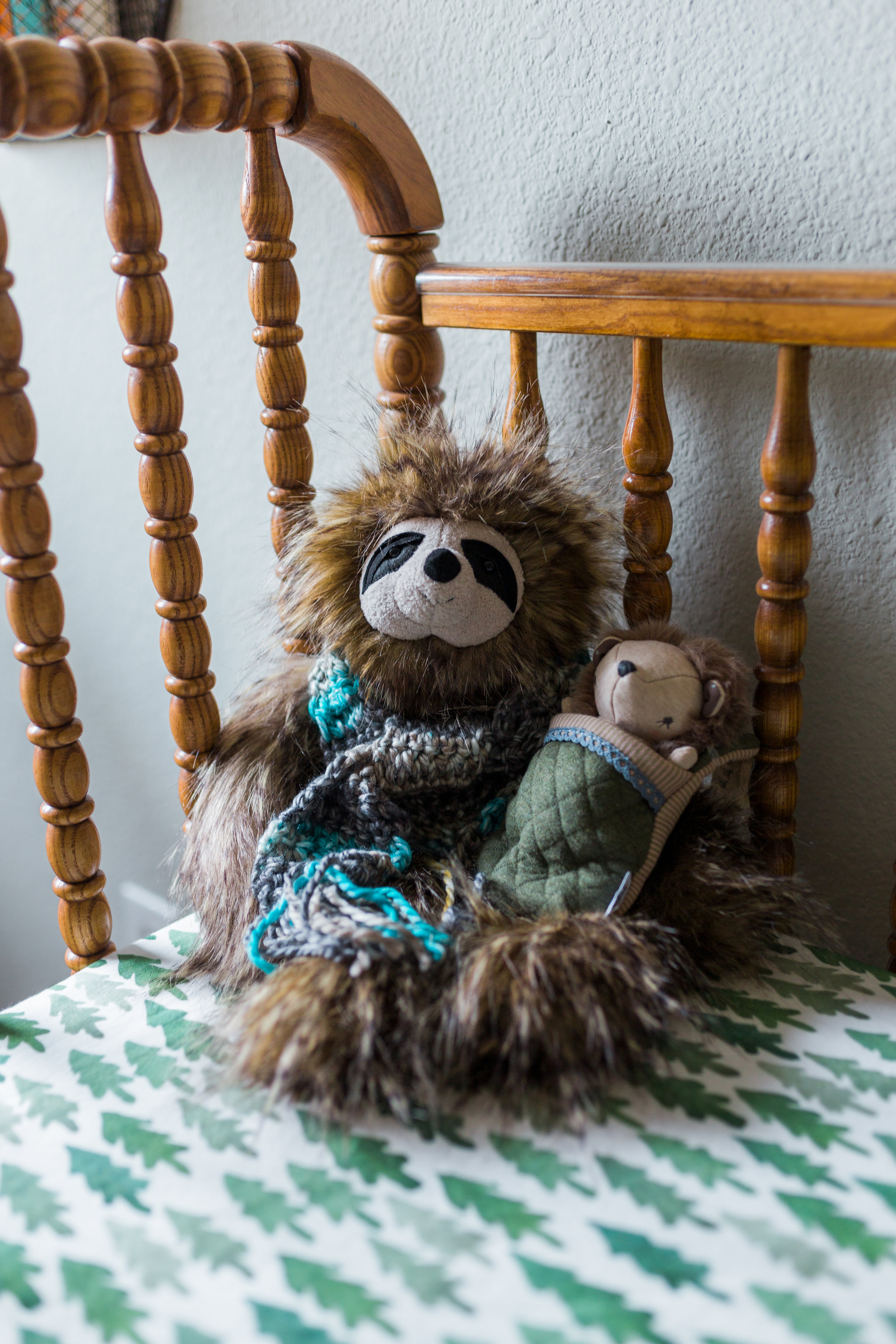 My mom bought this sloth because we saw one together at the Dallas World Museum when she flew here with me in January. Apparently it made her think of Wesley. :) She also made the scarf and a super-cute hat that matches it! Also, I'm obsessed with the sheets!! 