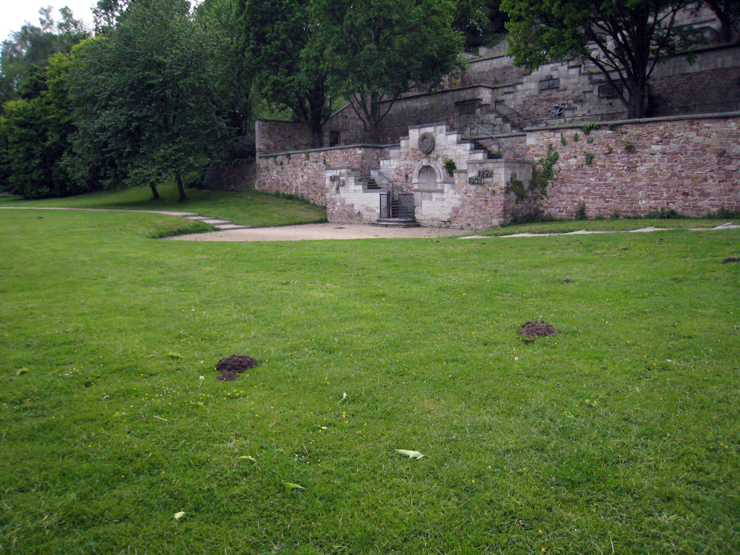  Molehills in front of a World War I memorial, Karlsaue Park.  