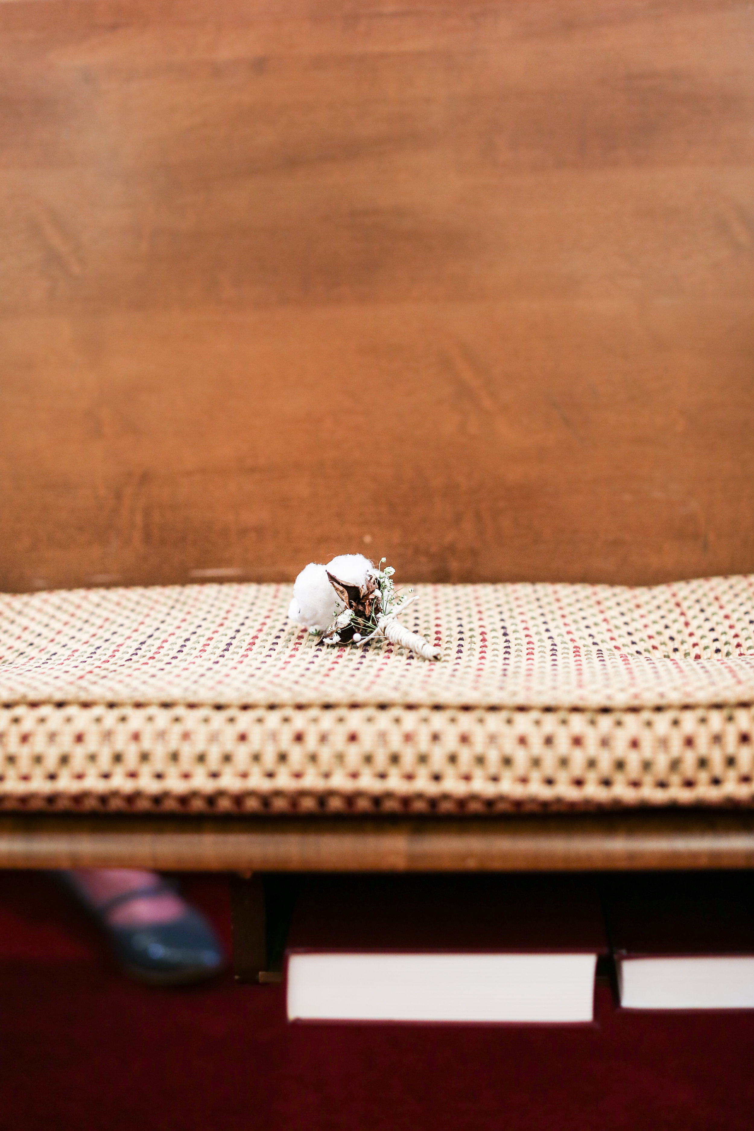 Leigh Ann's dad had passed away but she honored him by setting a boutonniere in the pew where he would have sat.