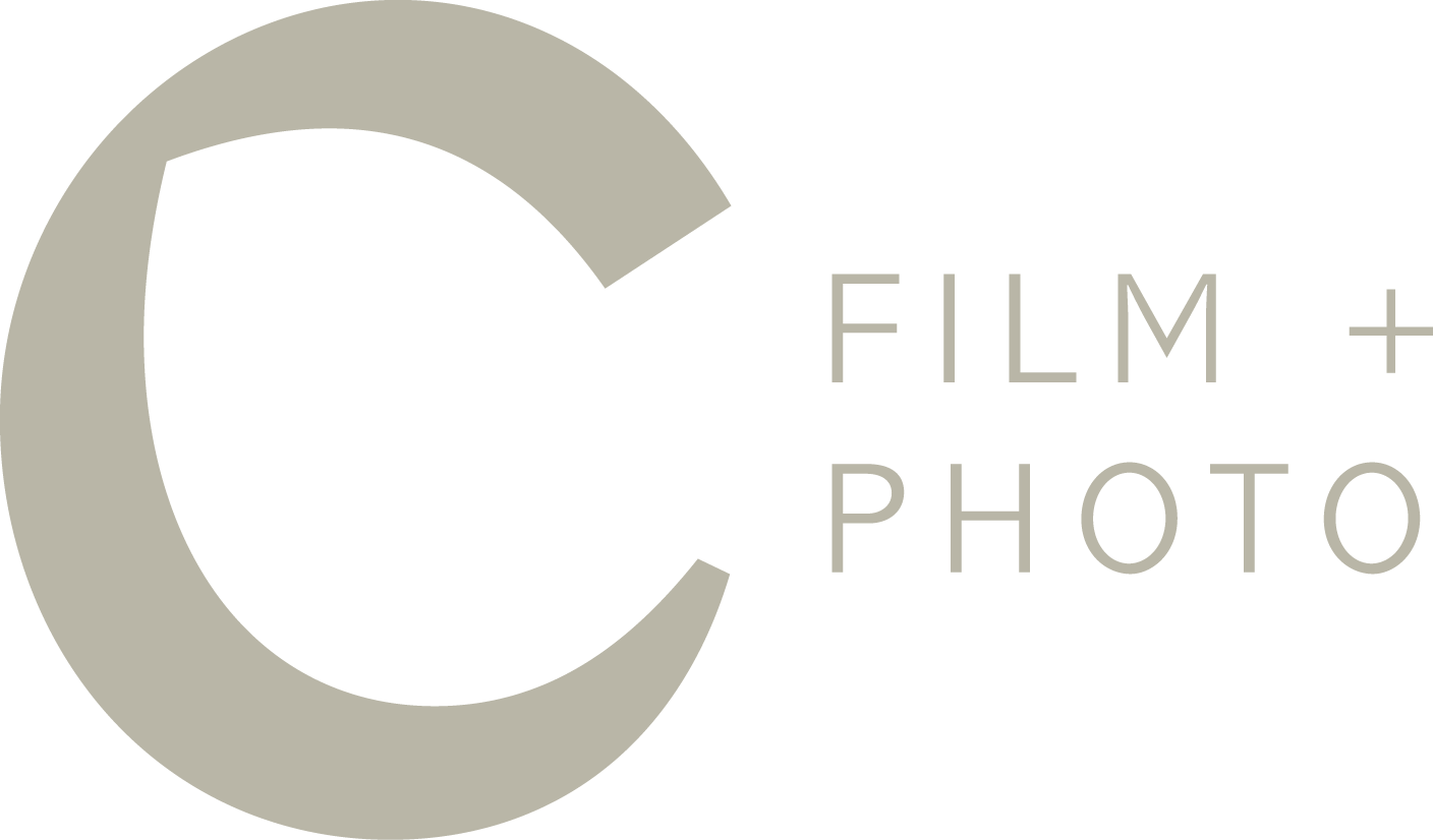 The logo of Cinesite Film + Photo, featuring a gray stylized letter 'C' with the words 'FIlM + PHOTO' next to it.