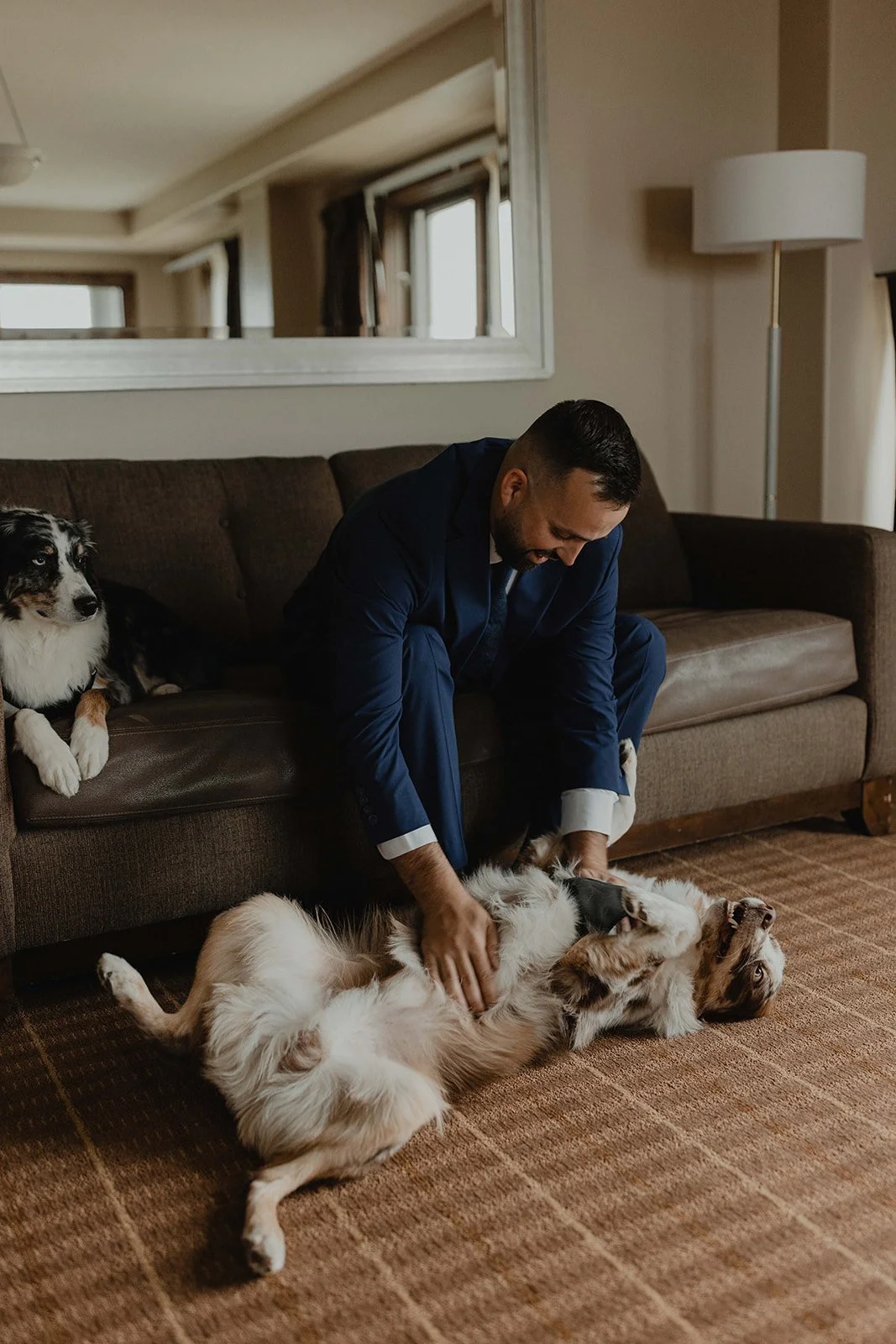 Bride and groom getting ready separately with their dogs in Telluride, Colorado