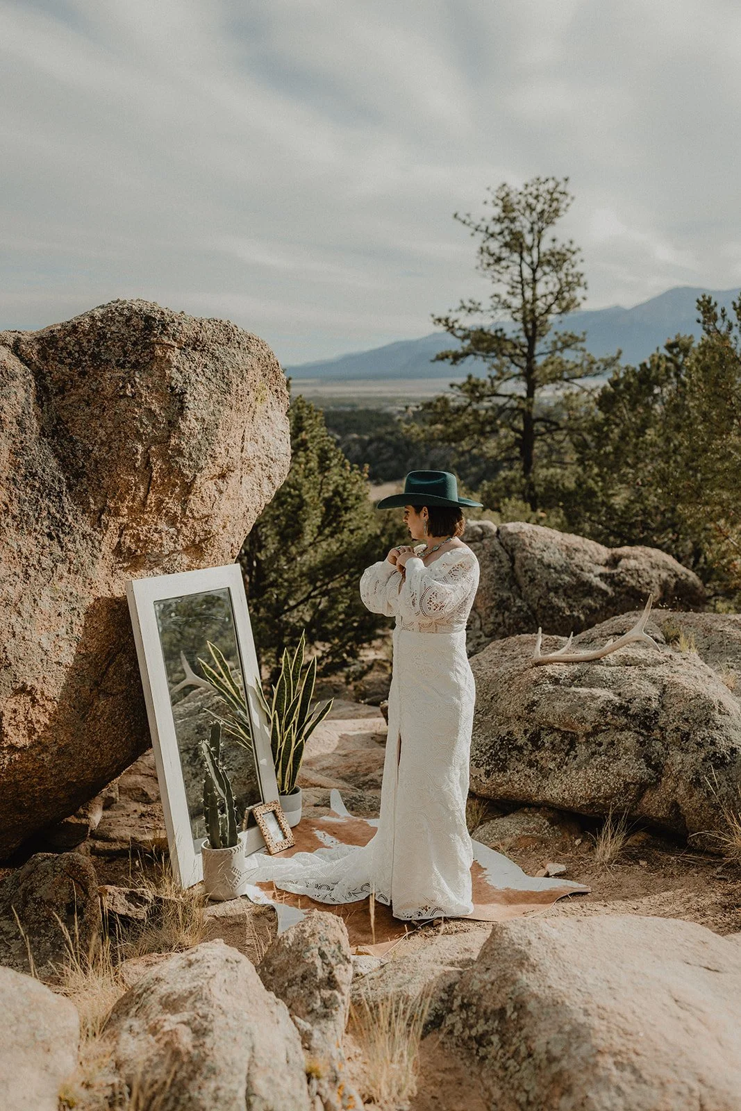 Bride getting ready at Turtle Rock elopement with mirror and rug in Buena Vista Colorado