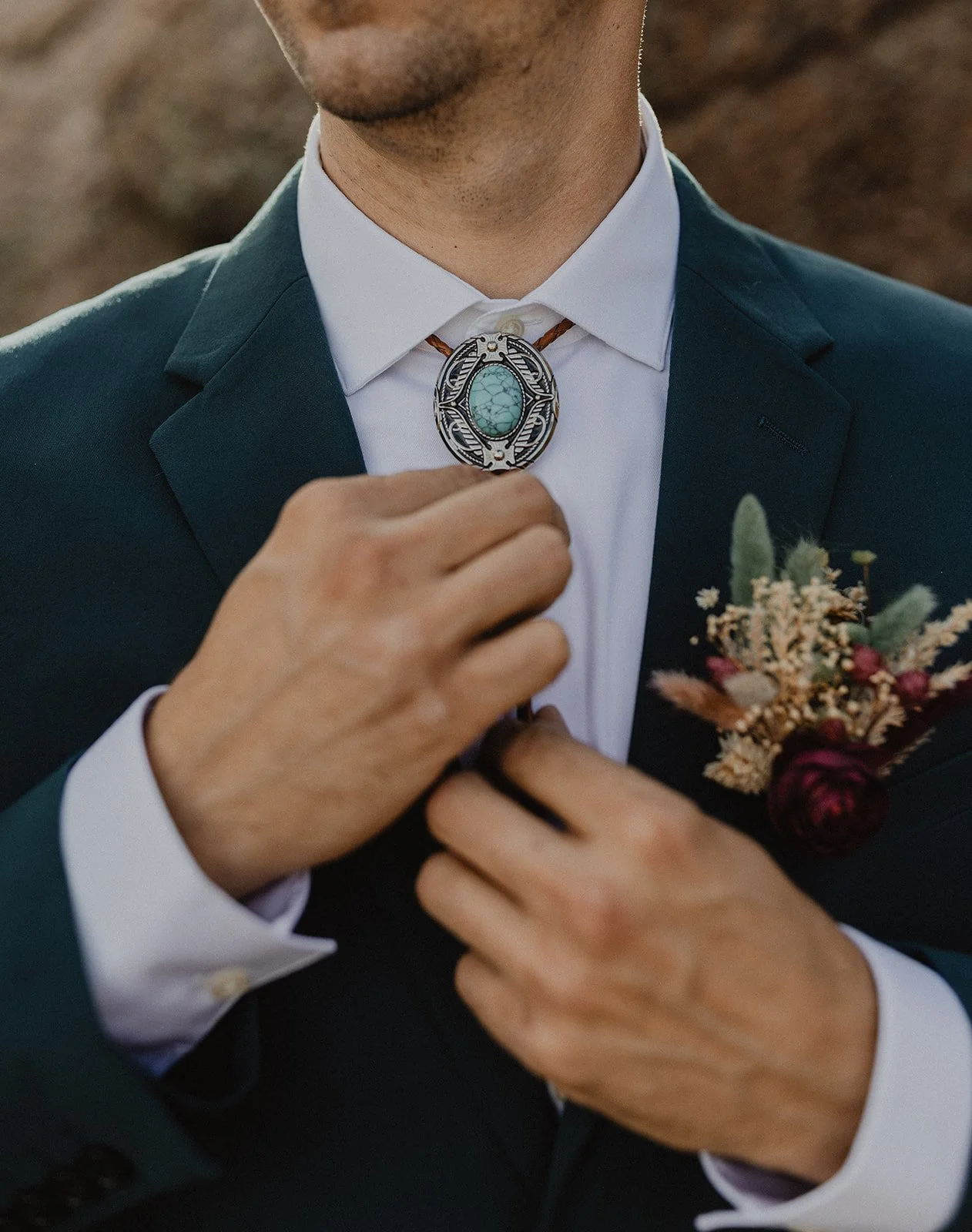 Candid elopement getting ready moment in Buena Vista Colorado with high desert backdrop